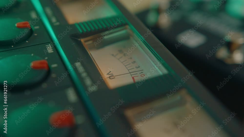 Analog VU meter on retro tape recorder, measuring level of sound in ...