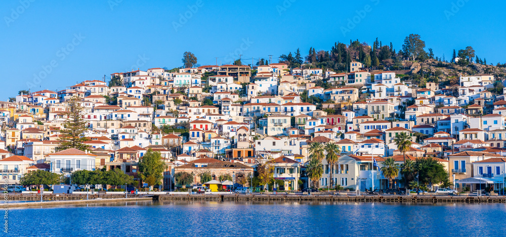 Poros, Greece - 17 February 2023 - View on the town of Poros on Poros island seen from the mainland