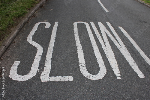 Wallpaper Mural UK road marking "Slow" painted on road, reminding motorists to slow down Torontodigital.ca