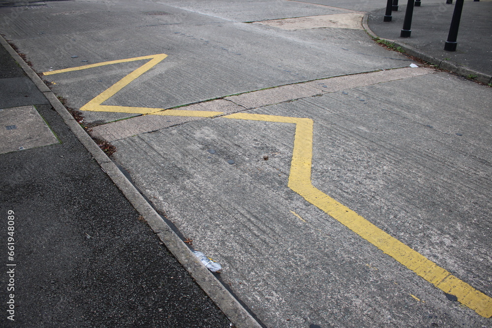 Yellow Zig Zag lines UK indicating to motorists to keep clear, no
