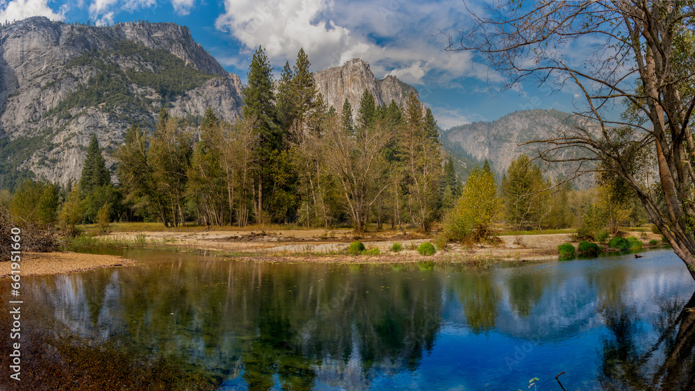 Yosemite,Merced river reflecting the mountains and sky above in the valley of where beauty surrounds you