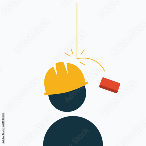 the head of a person wearing a safety helmet was hit by a brick