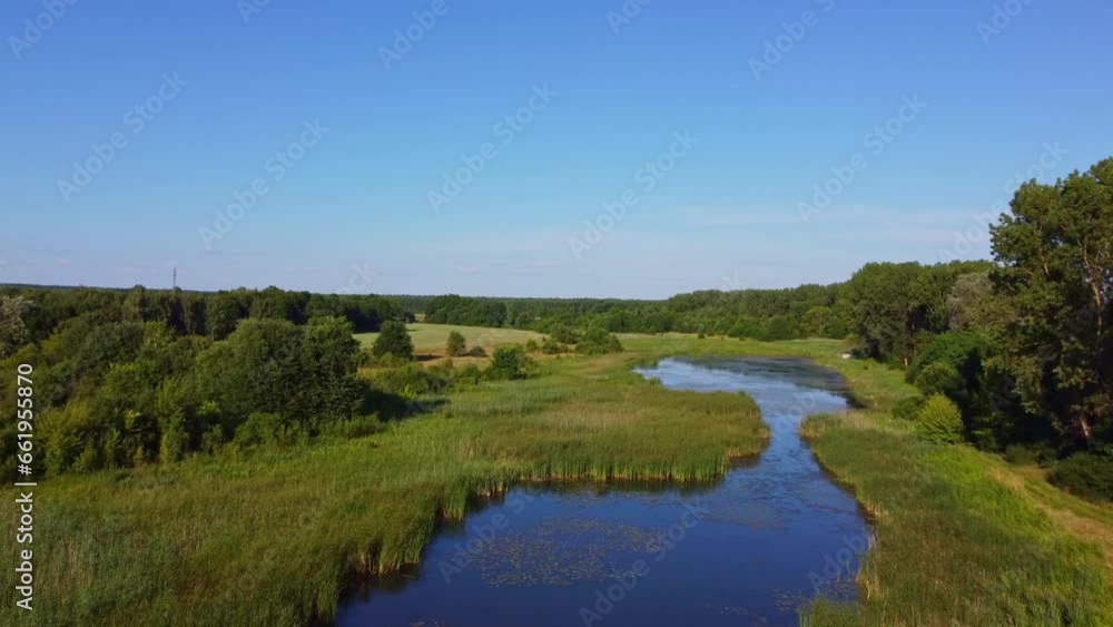A lake surrounded by greenery. Wieliszewskie Lake in Poland, aerial photography, drone filming A lake surrounded by greenery. Wieliszewskie Lake in Poland, aerial photography, drone filming