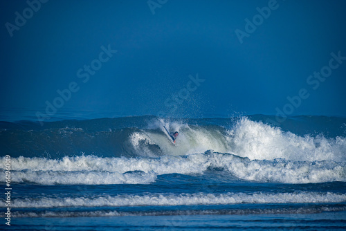 Bodyboarder surfing ocean wave