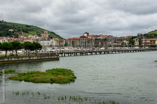 Skyline of the Zumaya village with the marina crowded of boats in Urola estuary in the foreground on a stormy day, Gipuzkoa, Basque Country, Spain © JMDuran Photography