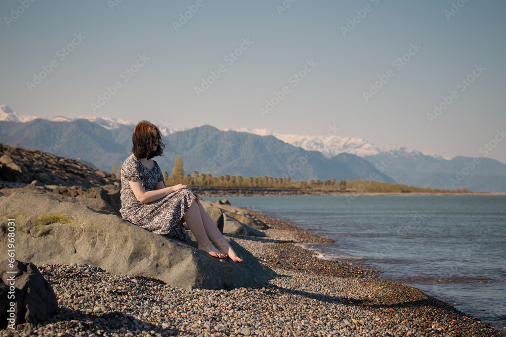 young caucasian girl  on background sea  landscape