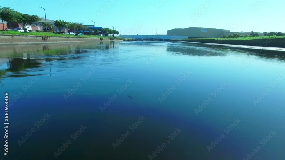 Drone, bridge and canal for water, irrigation and river link to sea for transportation and infrastructure in city. Landscape and nature or lake in neighborhood for urban development or outdoor travel Drone, bridge and canal for water, irrigation and river link to sea for transportation and infrastructure in city. Landscape and nature or lake in neighborhood for urban development or outdoor travel