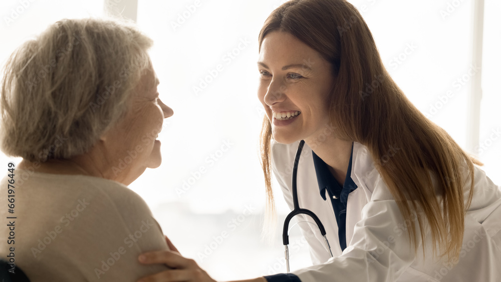 Female medical worker in white coat give support to older lady patient, express empathy and care during consultation of mature woman. Specialist doctor share good analyses results. Empathy, healthcare Female medical worker in white coat give support to older lady patient, express empathy and care during consultation of mature woman. Specialist doctor share good analyses results. Empathy, healthcare