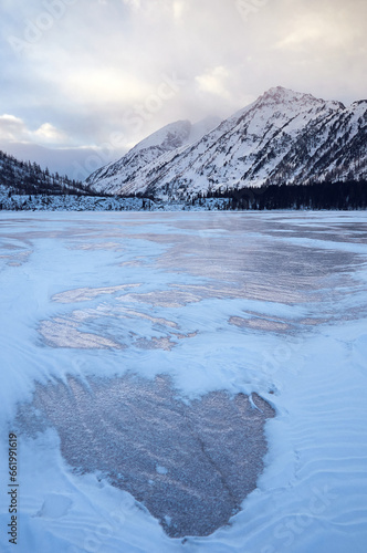 Snow-covered winter mountain lake, Russia, Siberia, Altai mountains. Multinskie lakes. photo