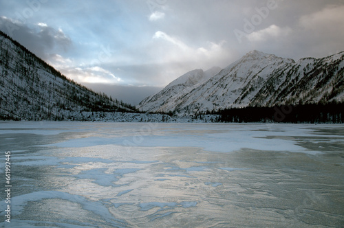 Snow-covered winter mountain lake, Russia, Siberia, Altai mountains. Multinskie lakes. photo