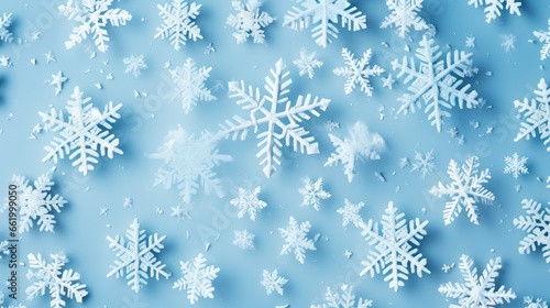 white snowflakes on light blue background