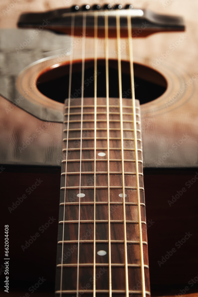 Dark detailed macro view of acoustic guitar frets and string and soundboard. Musical instruments and music theme Dark detailed macro view of acoustic guitar frets and string and soundboard. Musical instruments and music theme