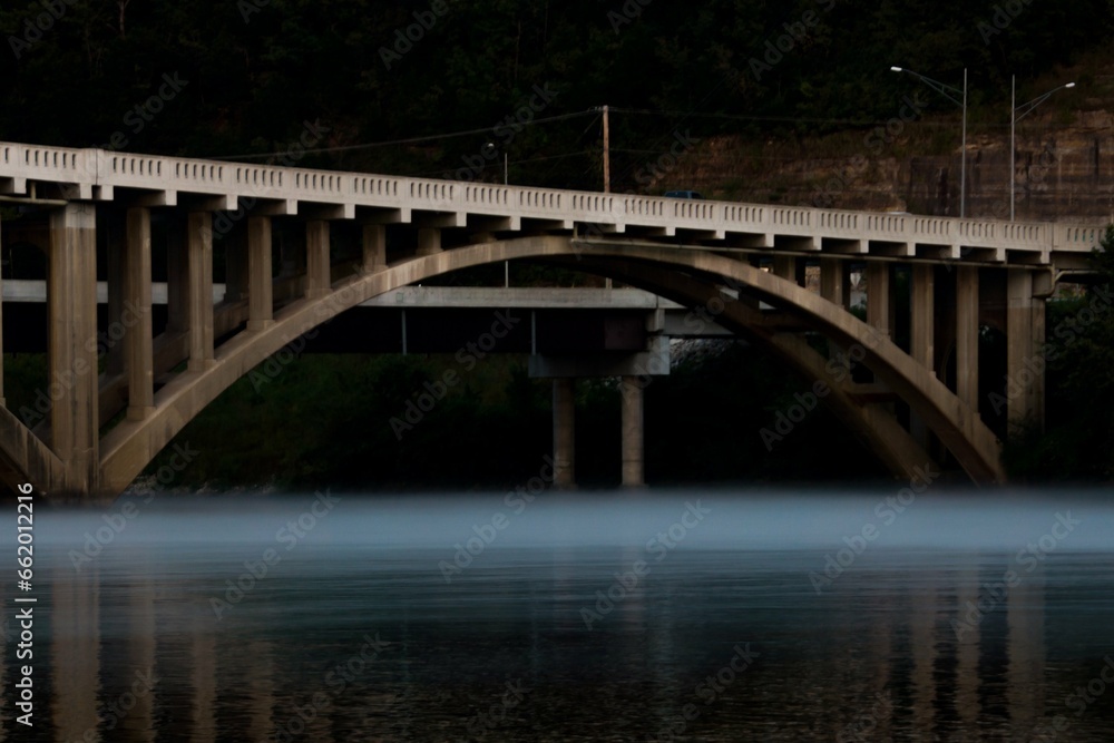 Bridge over water with fog