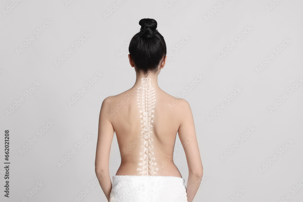 Woman with healthy back on light background. Illustration of spine - obrazy, fototapety, plakaty 