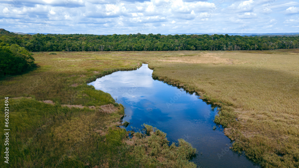 Lake and forest view in cloudy weather. The perfect nature of İğneada. Lake and forest in aerial drone view. Türkiye, İğneada, Mert Lake shot from above with a drone. Lake and forest view in cloudy weather. The perfect nature of İğneada. Lake and forest in aerial drone view. Türkiye, İğneada, Mert Lake shot from above with a drone.