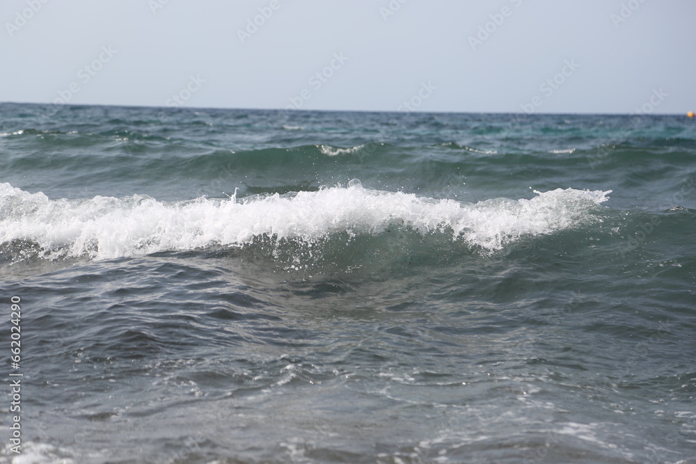 sea waves at beach nature background. sea waves at beach in summer. photo of sea waves