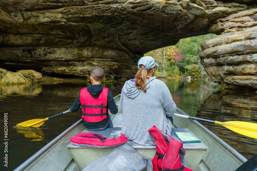 Mom and son in boat on lake