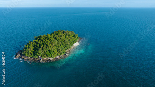 Seascape with small island. Blue sea surface from above, sea from a drone. Beauty of nature concept backgroun. beautiful island