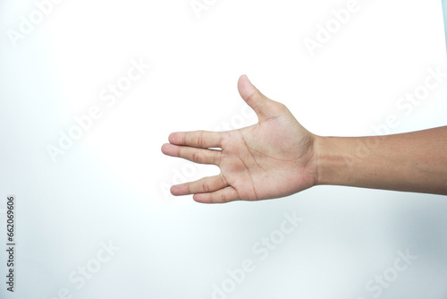Man stretching hand to handshake isolated on a white background. Man hand ready for handshaking © AriaSandi
