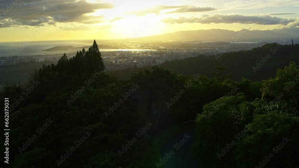 Mountain Silhouette and Beautiful Sunset Glow On Honolulu, Hawaii - Drone Shot Mountain Silhouette and Beautiful Sunset Glow On Honolulu, Hawaii - Drone Shot