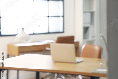Blurred view of stylish office with workplaces