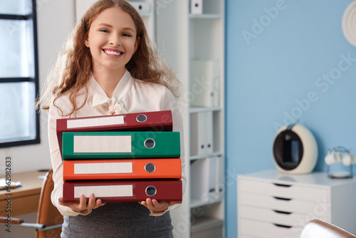 Young businesswoman with do...