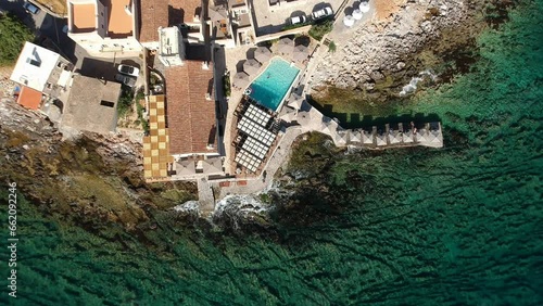 Aerial scenic view of the traditional fishing village Gerolimenas and the old port. Its one of the most picturesque settlements of Mani with crystal water and a small natural harbor in Laconia, Greece