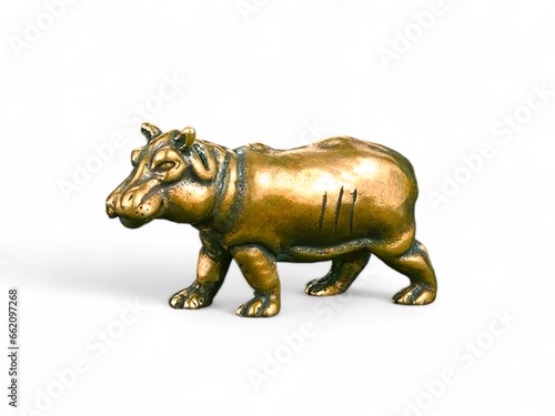 Miniature animal gold color hippo on white background 