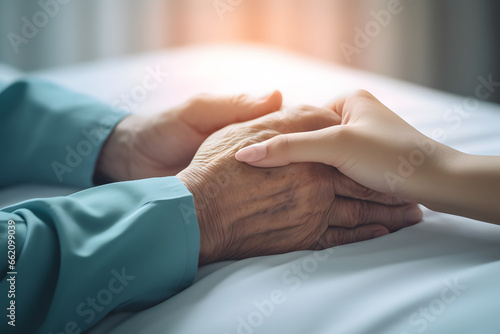 closeup hand of geriatric with nursing caregiver.