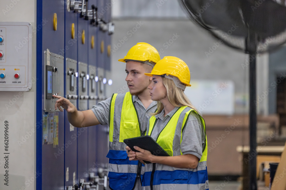 Techs inspecting, maintaining cardboard machine for safety, uninterrupted, high-quality production. Techs inspecting, maintaining cardboard machine for safety, uninterrupted, high-quality production.