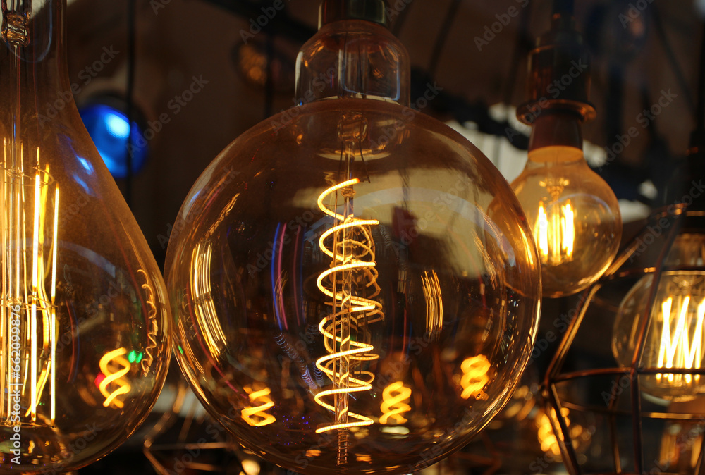 Close up photo of a modern, creative, retro lamp hanging in a shop.