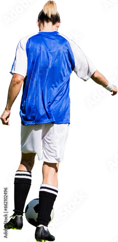 Digital png photo of back of caucasian female footballer with ball on transparent background