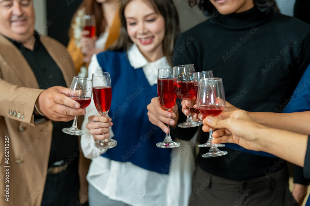 Group of office workers celebrate Christmas and New Year by dancing and drinking wine. Group of international friends and boss dancing with employees. Group of office workers celebrate Christmas and New Year by dancing and drinking wine. Group of international friends and boss dancing with employees.