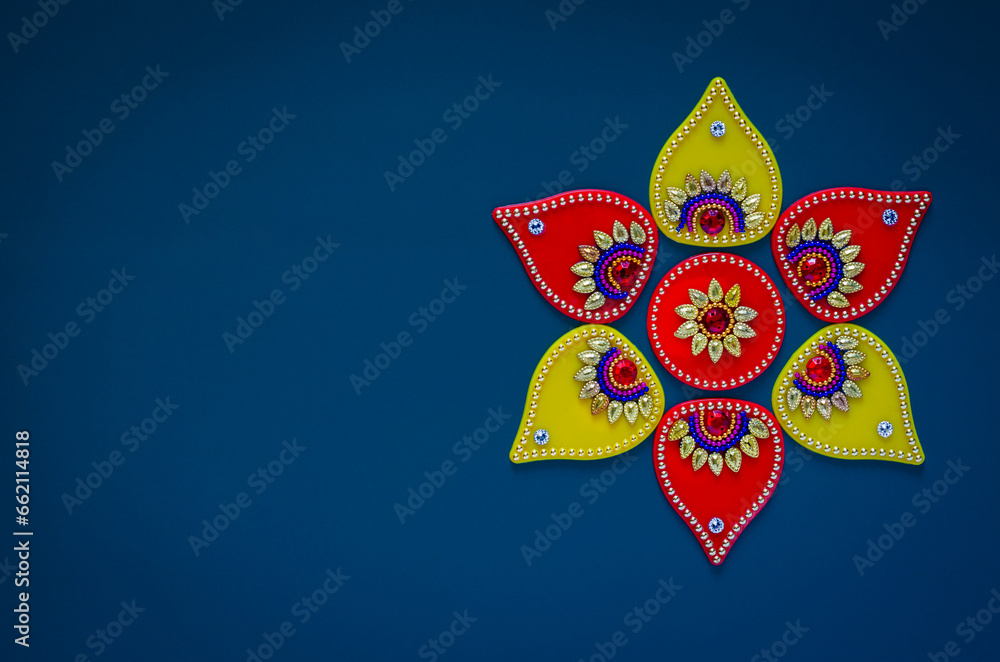Diwali festival decorative object that can put with diwa lamp for decoration on blue background. - obrazy, fototapety, plakaty 