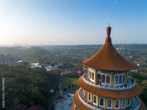 Aerial view of Wuji Tianyuan Temple by drone in Tamsui, New Taipei City, Taiwan. Beautiful weather, blue sky and mountains.