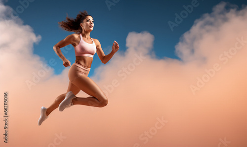 Active female athlete running mid air in a vigorou