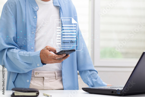 person using smartphone with ducument electronic signature at workplace, Electronic Signature data reference concept	
	