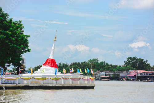White tilt Mon pagoda beside the Chao Phraya River at Wat Poramai Yikawat Worawihan, Koh Kret, Nonthaburi. photo