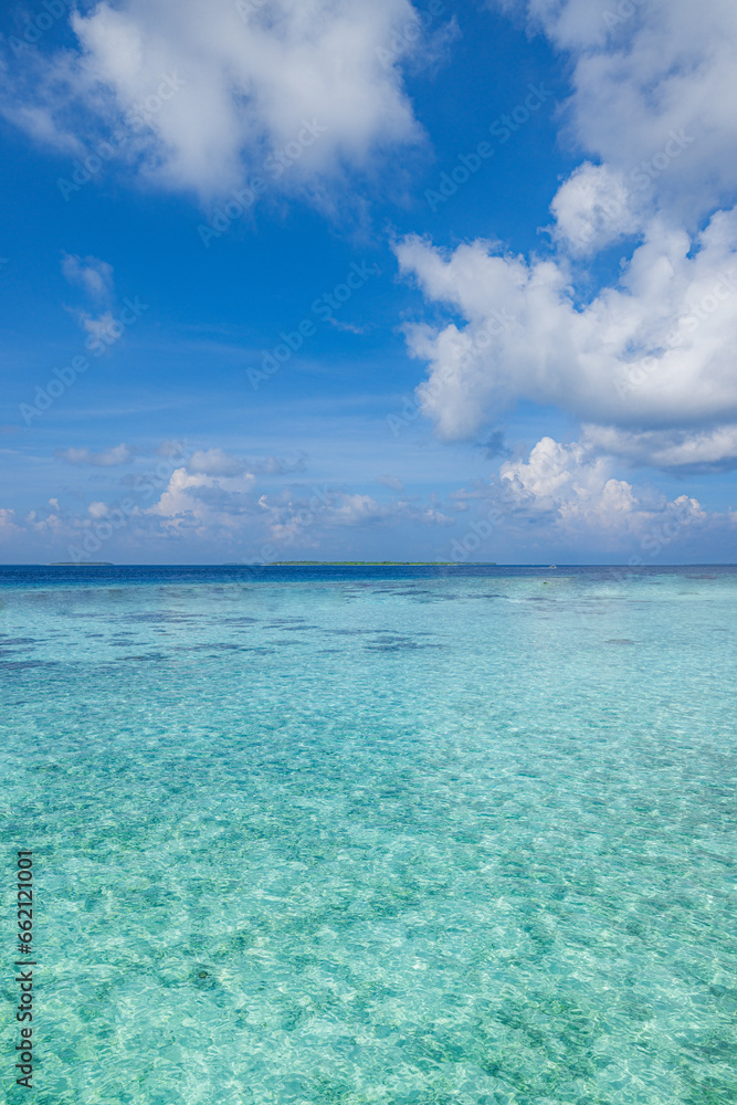 Indian Ocean, beautiful calm turquoise water and blue sky with few clouds. Tropical beach panorama, seascape with wide horizon. Skyscape sunny inspirational exotic sea surface. Climate ecology concept Indian Ocean, beautiful calm turquoise water and blue sky with few clouds. Tropical beach panorama, seascape with wide horizon. Skyscape sunny inspirational exotic sea surface. Climate ecology concept
