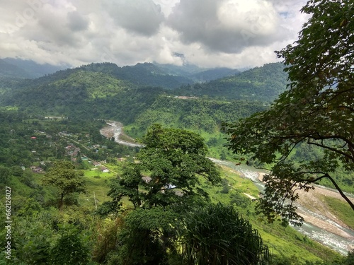 view from the mountain with clouds and river