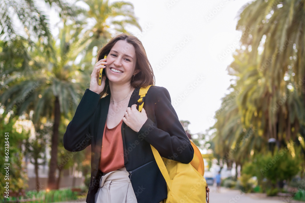 Smiling casual woman talking to the mobile Smiling casual woman talking to the mobile
