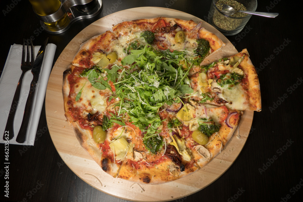 A vegetarian pizza with arugula