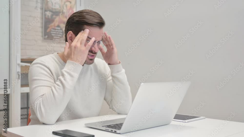 Middle Aged Man having Headache at Work Middle Aged Man having Headache at Work
