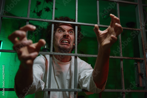 Mentally unstable male patient with attack of rabies locked in cage ward