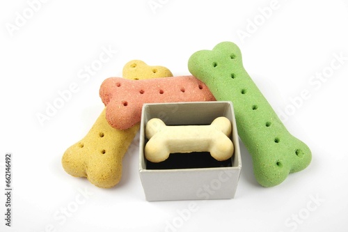 dog biscuits and coloured dog bones with a presentation box on a white background  