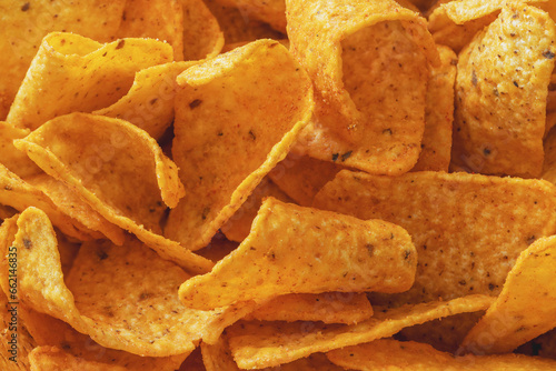 Close-up of a stack of cheese-flavored corn chips photo