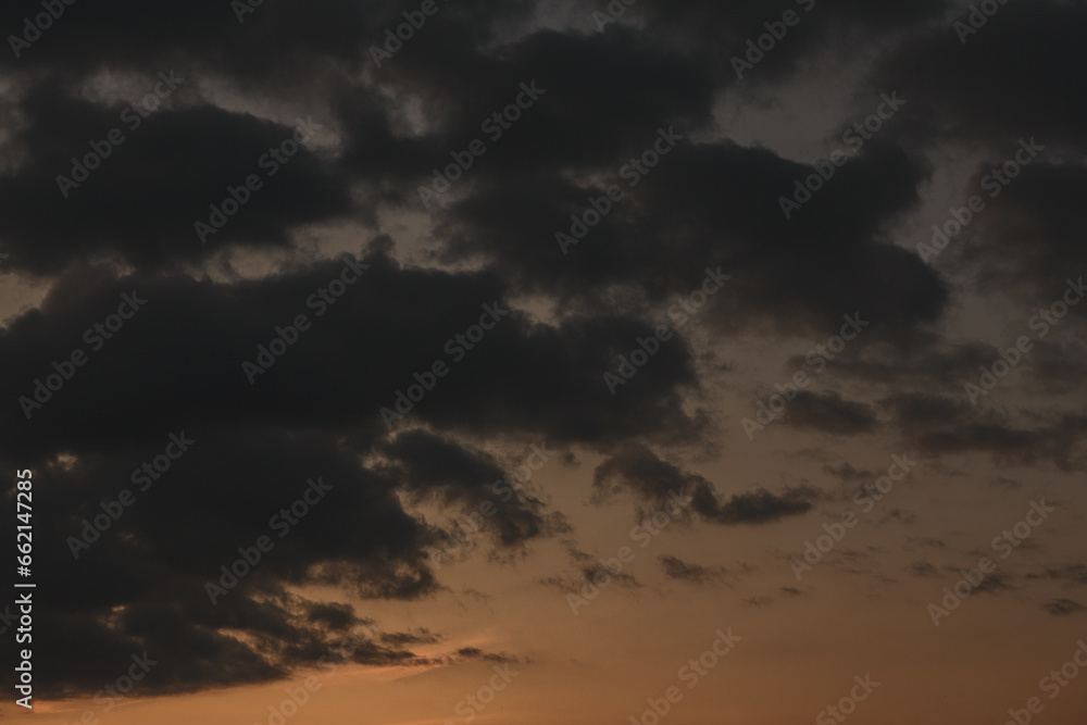 Stormy sky with dark clouds. Natural background. Sky background. Cloudscape, Colored Sunset.
