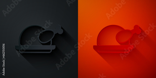 Paper cut Roasted turkey or chicken icon isolated on black and red background. Paper art style. Vector