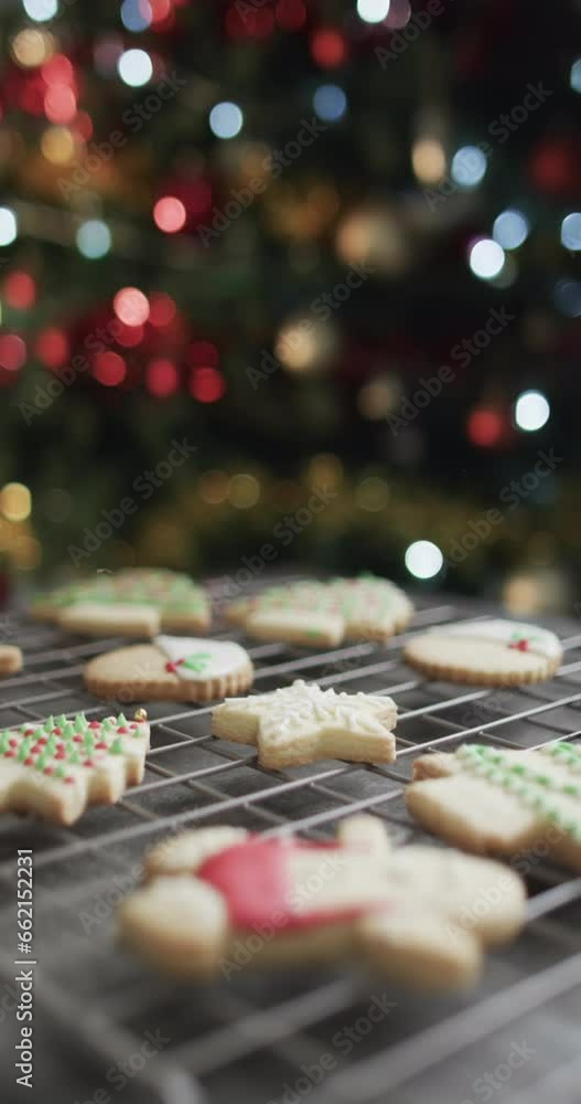 Vertical video of christmas cookies with sugar, chrismtas tree and copy space on black background Vertical video of christmas cookies with sugar, chrismtas tree and copy space on black background