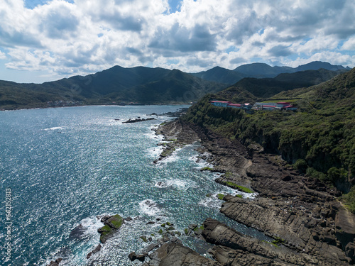 Aerial view of Bitoujiao lighthouse, a famous scenery of Taiwan northeast corner. Birds eye view in Bitoujiao cape, Ruifang district, New Taipei, Taiwan. photo